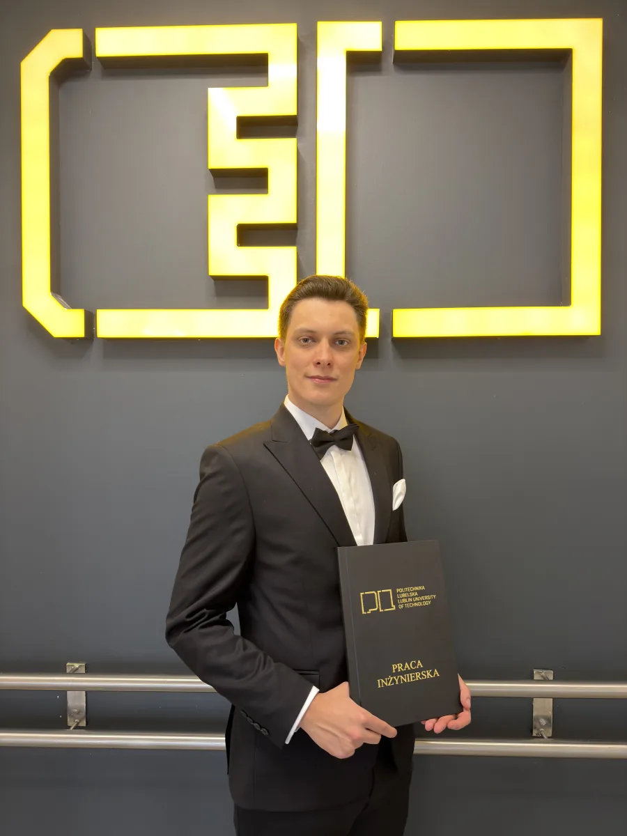 Jacek Kozłowski holding his engineering thesis at Lublin University of Technology